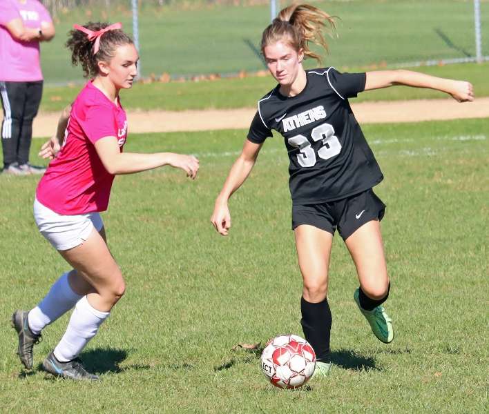 TROY CLINCHES LEAGUE TITLE; EDGES ATHENS, 2-1, IN OVERTIME